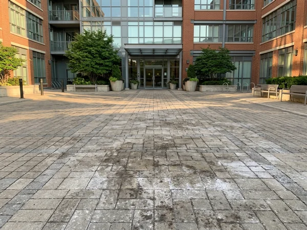 Condo pressure washing Toronto entrance plaza in Liberty Village (before)