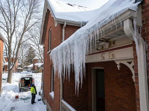 Ice dam and icicles on a North York home before removal