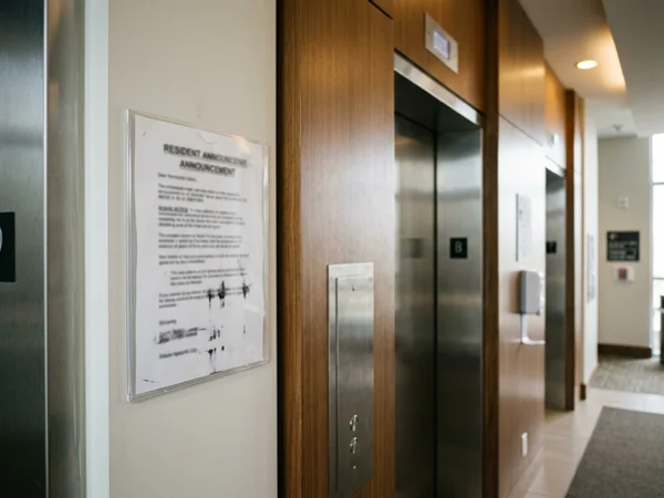 Resident notice for weekend exterior washing posted in a condo lobby